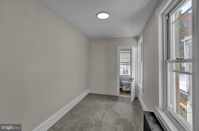 1120 N 10th St, Reading, PA 19604 - empty room with baseboards and carpet flooring