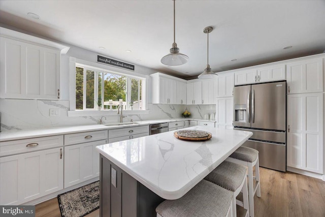 209 Burlington Ave, Voorhees, NJ 08043 - kitchen featuring stainless steel appliances, a sink, and white cabinetry