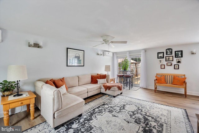 209 Burlington Ave, Voorhees, NJ 08043 - living area with wood finished floors, ceiling fan, and a wall unit AC
