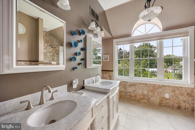 209 Burlington Ave, Voorhees, NJ 08043 - bathroom featuring tile patterned floors, double vanity, and lofted ceiling