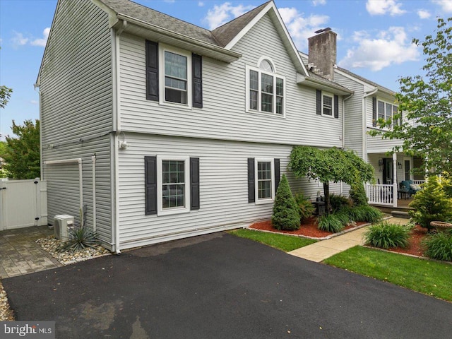 209 Burlington Ave, Voorhees, NJ 08043 - view of front of home featuring a chimney and a cooling unit