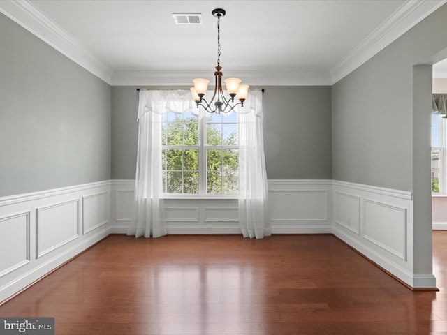 9204 Charleston Dr Unit 407, Manassas, VA 20110 - empty room featuring a chandelier, a wainscoted wall, wood finished floors, crown molding, and a decorative wall
