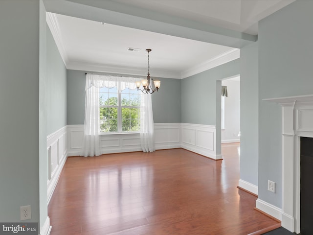 9204 Charleston Dr Unit 407, Manassas, VA 20110 - unfurnished dining area with crown molding, a chandelier, wood finished floors, and wainscoting
