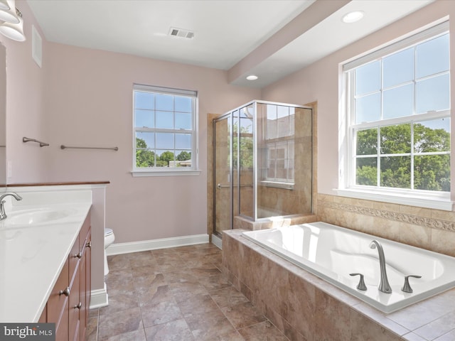 9204 Charleston Dr Unit 407, Manassas, VA 20110 - bathroom featuring vanity, healthy amount of natural light, baseboards, a garden tub, and recessed lighting