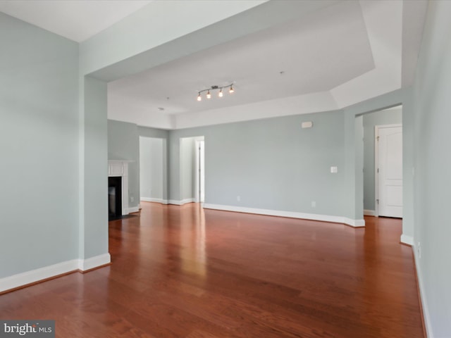 9204 Charleston Dr Unit 407, Manassas, VA 20110 - unfurnished living room featuring wood finished floors, baseboards, and a fireplace with flush hearth