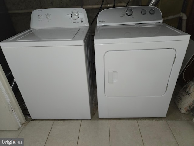 7657 Sheffield Village Ln, Lorton, VA 22079 - laundry room with washer and dryer and light tile patterned flooring