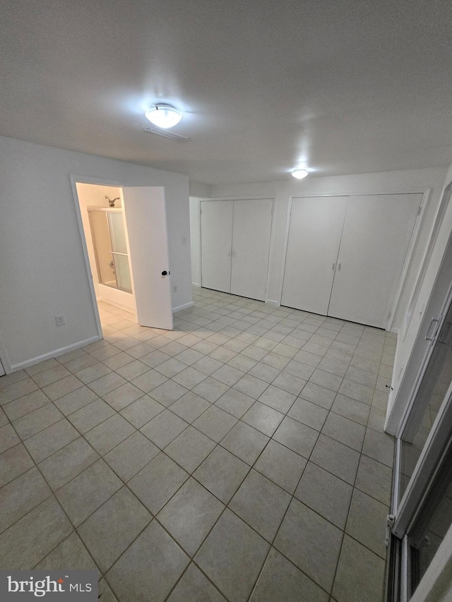 7657 Sheffield Village Ln, Lorton, VA 22079 - below grade area with light tile patterned flooring and baseboards