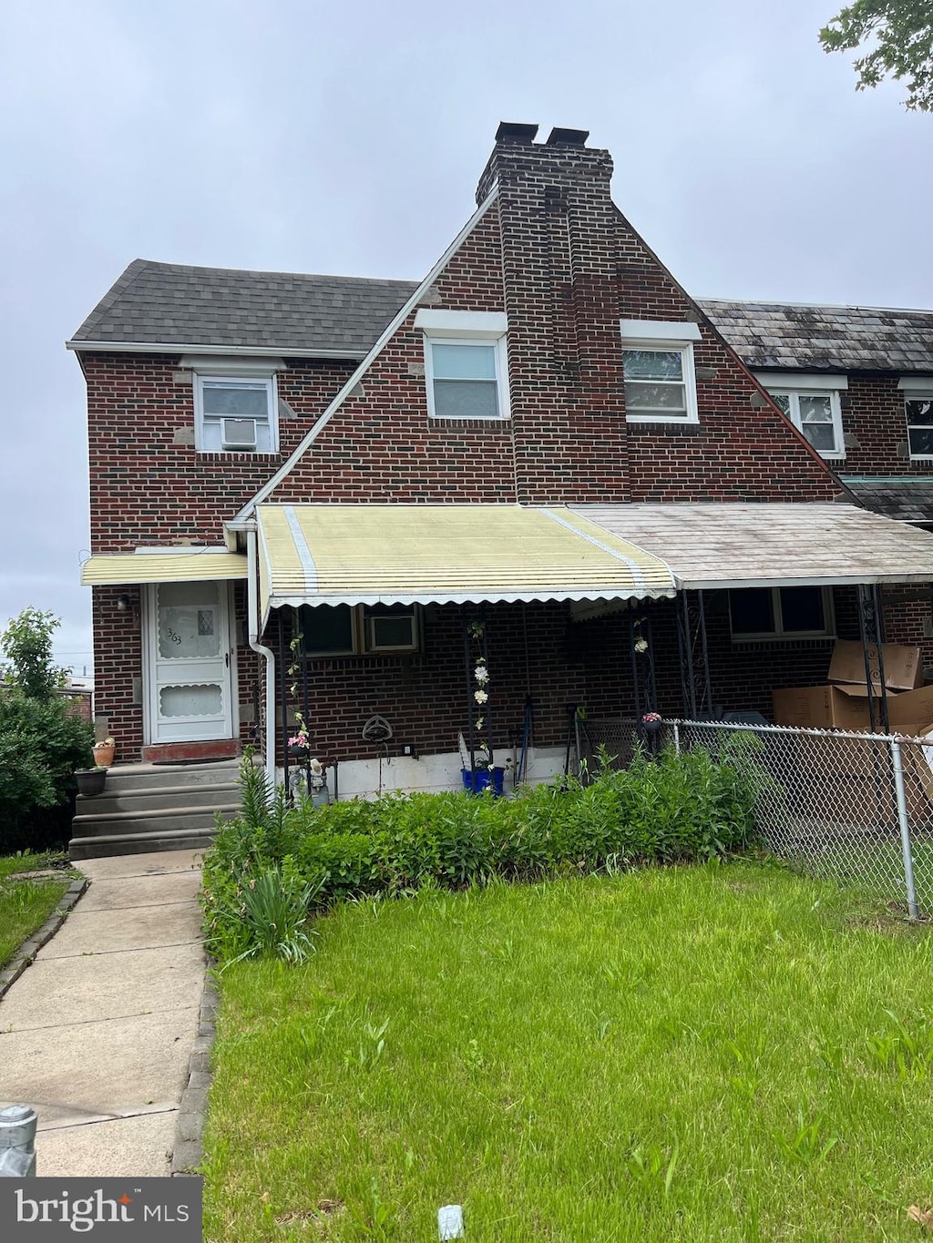 363 Sherbrook Blvd, Upper Darby, PA 19082 - view of front of property featuring brick siding, a chimney, and a shingled roof