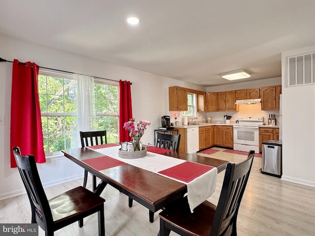 8565 E St, Chesapeake Beach, MD 20732 - dining area featuring light wood-style floors and baseboards