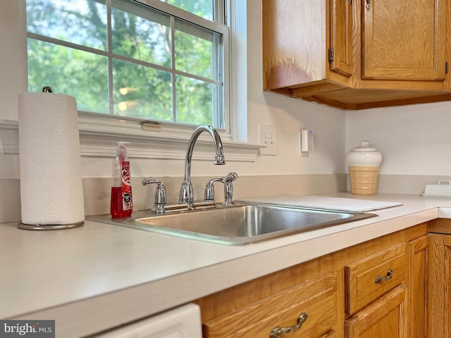 8565 E St, Chesapeake Beach, MD 20732 - kitchen featuring a sink, light countertops, and brown cabinets