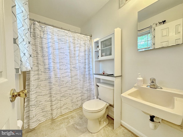 8565 E St, Chesapeake Beach, MD 20732 - full bathroom with toilet, a sink, a shower with curtain, and tile patterned flooring