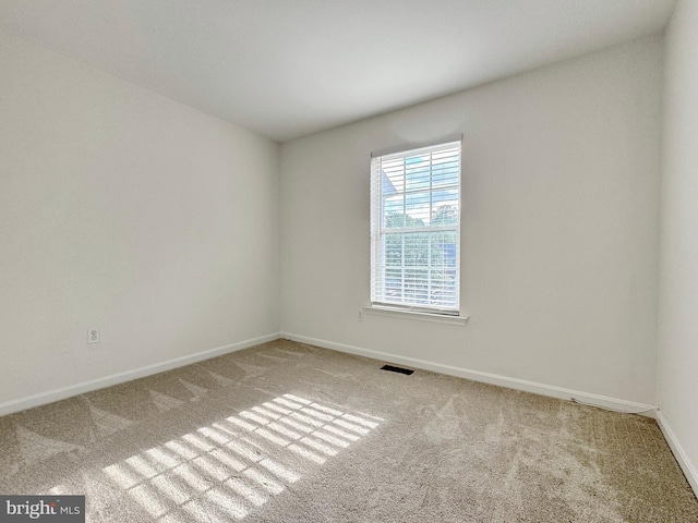 8565 E St, Chesapeake Beach, MD 20732 - carpeted empty room featuring baseboards