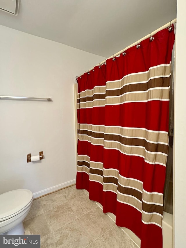 8565 E St, Chesapeake Beach, MD 20732 - bathroom with toilet, baseboards, and tile patterned flooring