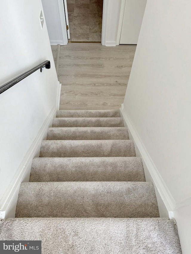 8565 E St, Chesapeake Beach, MD 20732 - stairway featuring wood finished floors
