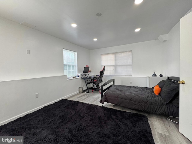 8565 E St, Chesapeake Beach, MD 20732 - bedroom with wood finished floors, recessed lighting, baseboards, and an office area