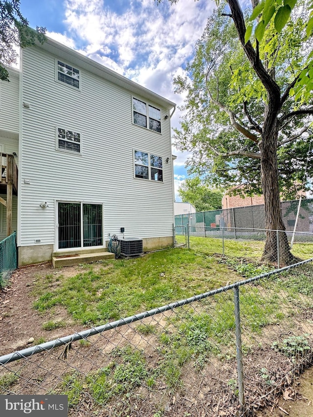 8565 E St, Chesapeake Beach, MD 20732 - rear view of house with central AC unit