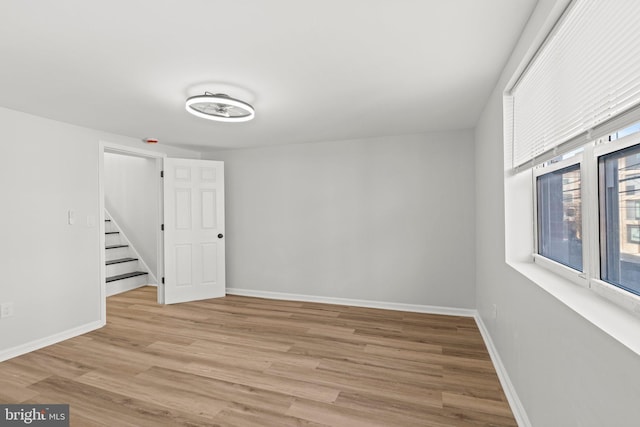 2036 E Huntingdon St, Philadelphia, PA 19125 - unfurnished room with stairs, light wood-style flooring, and baseboards
