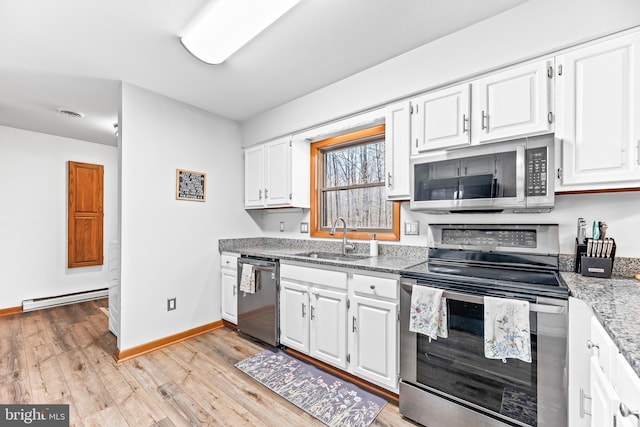 15180 Deborah Dr, Hughesville, MD 20637 - kitchen with stainless steel appliances, a sink, a baseboard heating unit, light wood finished floors, and light stone countertops