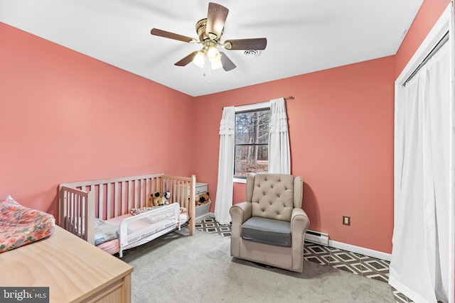 15180 Deborah Dr, Hughesville, MD 20637 - bedroom with a baseboard heating unit, baseboards, and ceiling fan