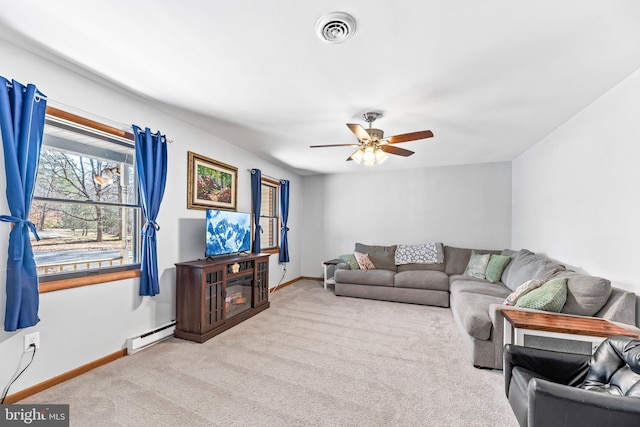 15180 Deborah Dr, Hughesville, MD 20637 - carpeted living room featuring baseboards, a ceiling fan, and a baseboard heating unit
