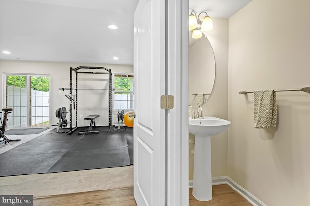 1022 Linden Dr, Hanover, MD 21076 - bathroom featuring healthy amount of natural light, recessed lighting, baseboards, and wood finished floors