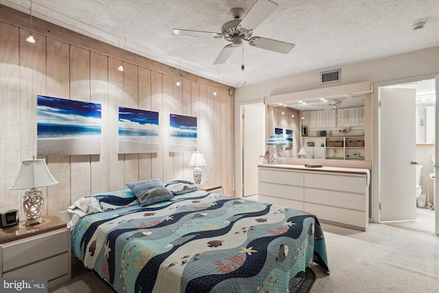 902 Dover House Rd Unit 902S, Bethany Beach, DE 19930 - bedroom featuring light carpet, ensuite bathroom, ceiling fan, and a textured ceiling