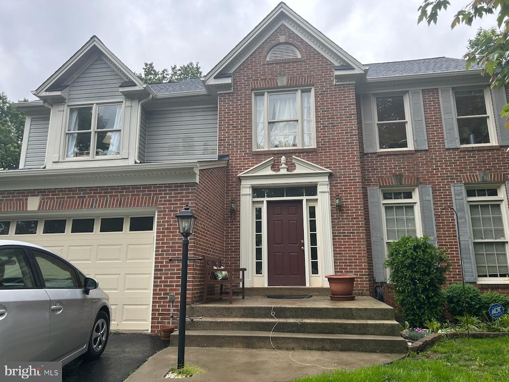 20622 Langford Ct, Sterling, VA 20165 - view of front of home with brick siding and an attached garage