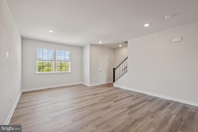 16612 Green Glade Dr, Brandywine, MD 20613 - unfurnished room with stairway, light wood-type flooring, baseboards, recessed lighting, and a smoke detector