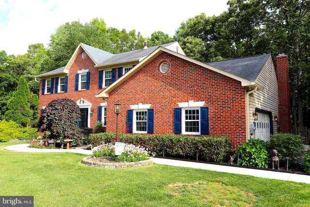 2320 Knotweed Ct, Waldorf, MD 20603 - view of front facade featuring brick siding, an attached garage, a front yard, a chimney, and a shingled roof