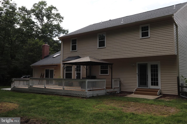 2320 Knotweed Ct, Waldorf, MD 20603 - rear view of property featuring a yard, a wooden deck, entry steps, and a chimney