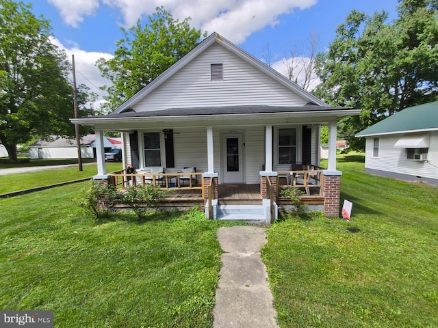 2411 Washington Ave, Victoria, VA 23974 - bungalow-style home featuring a porch, a front yard, and cooling unit