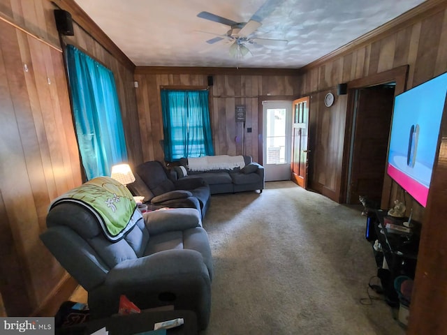 2411 Washington Ave, Victoria, VA 23974 - carpeted living room featuring wooden walls and a ceiling fan