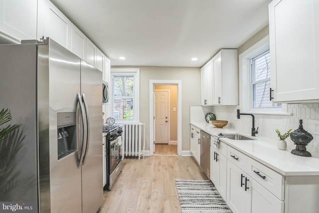 207 W Albanus St, Philadelphia, PA 19120 - kitchen with stainless steel appliances, a sink, white cabinetry, light countertops, and recessed lighting