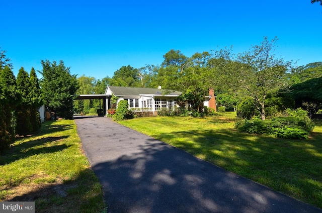 1009 Potts Mill Rd, Bordentown, NJ 08505 - view of front of property with asphalt driveway, a front lawn, and an attached carport