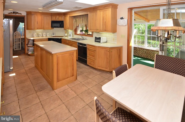 1009 Potts Mill Rd, Bordentown, NJ 08505 - kitchen with black appliances, decorative backsplash, light countertops, light tile patterned floors, and recessed lighting