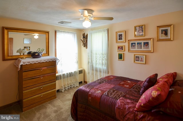 1009 Potts Mill Rd, Bordentown, NJ 08505 - bedroom with carpet flooring, radiator heating unit, and a ceiling fan
