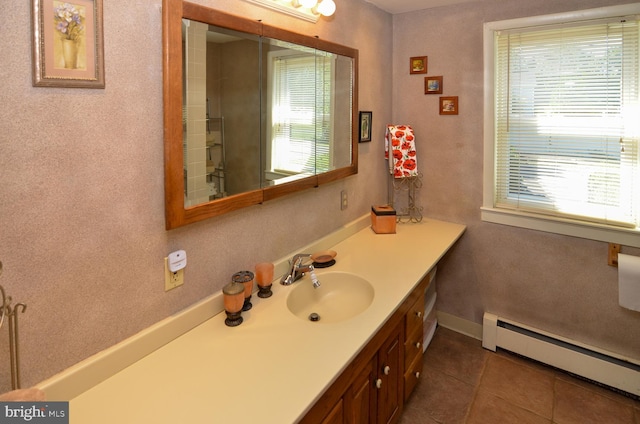 1009 Potts Mill Rd, Bordentown, NJ 08505 - bathroom with baseboard heating, healthy amount of natural light, vanity, and tile patterned flooring