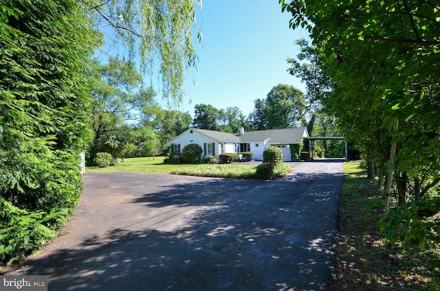1009 Potts Mill Rd, Bordentown, NJ 08505 - ranch-style house with driveway, a front lawn, and an attached carport