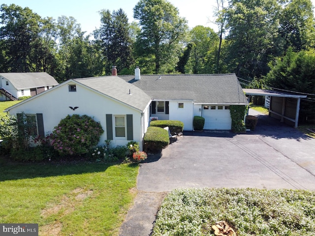 1009 Potts Mill Rd, Bordentown, NJ 08505 - view of front facade with asphalt driveway, a front lawn, a garage, a shingled roof, and a chimney