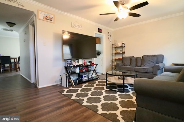 2460 Kilpatrick Pl, Dumfries, VA 22026 - living area featuring dark wood finished floors, a ceiling fan, ornamental molding, and baseboards