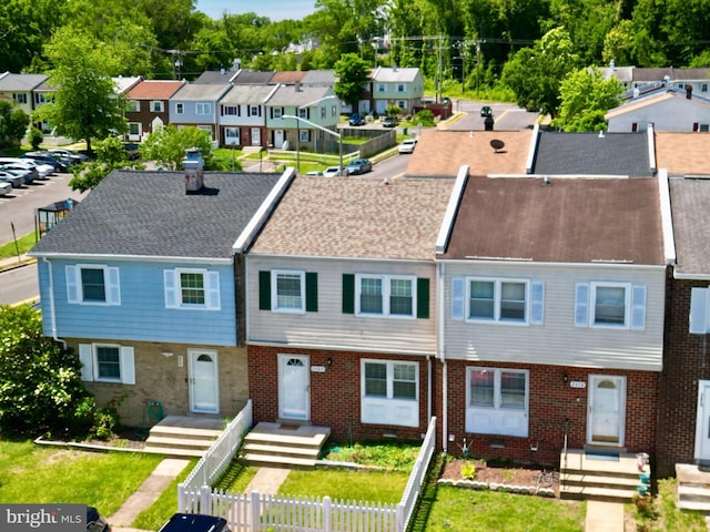 2460 Kilpatrick Pl, Dumfries, VA 22026 - view of property with a residential view, brick siding, and a chimney