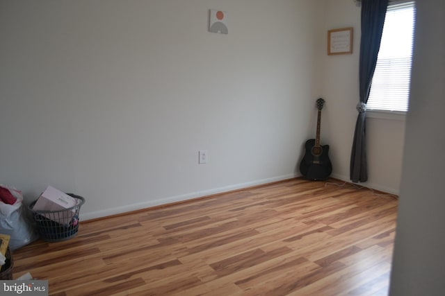 2460 Kilpatrick Pl, Dumfries, VA 22026 - spare room featuring healthy amount of natural light, light wood finished floors, and baseboards