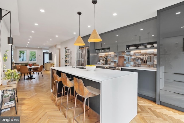 2426 4th St NE, Washington, DC 20002 - kitchen featuring gray cabinetry, modern cabinets, pendant lighting, recessed lighting, and a breakfast bar