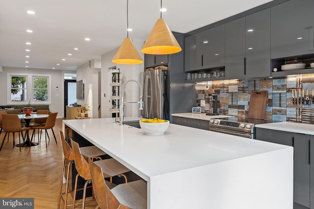 2426 4th St NE, Washington, DC 20002 - kitchen featuring appliances with stainless steel finishes, modern cabinets, gray cabinets, open floor plan, and a large island with sink