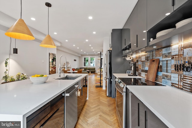 2426 4th St NE, Washington, DC 20002 - kitchen with a sink, appliances with stainless steel finishes, open floor plan, light countertops, and recessed lighting