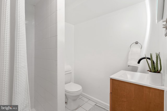 2426 4th St NE, Washington, DC 20002 - full bathroom with vanity, toilet, tile patterned floors, a tile shower, and baseboards