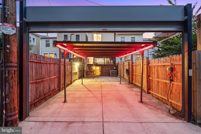 2426 4th St NE, Washington, DC 20002 - patio terrace at dusk with cooling unit, a carport, and stairway