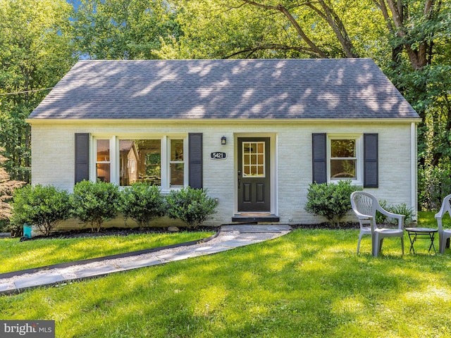 5421 Bartonsville Rd, Frederick, MD 21704 - view of front of home with brick siding, roof with shingles, and a front yard