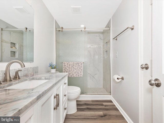 5421 Bartonsville Rd, Frederick, MD 21704 - bathroom with toilet, vanity, a marble finish shower, and wood finished floors
