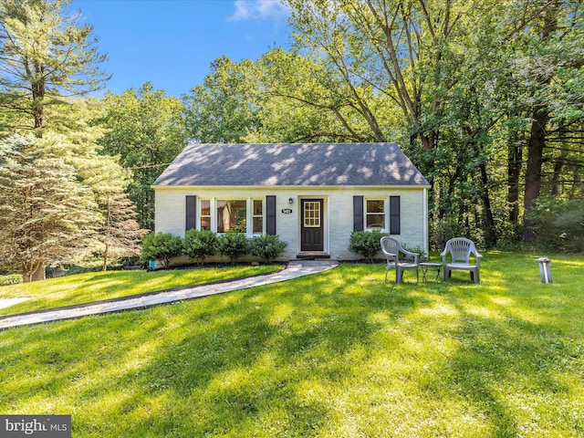 5421 Bartonsville Rd, Frederick, MD 21704 - view of front of house featuring a front yard, roof with shingles, and brick siding